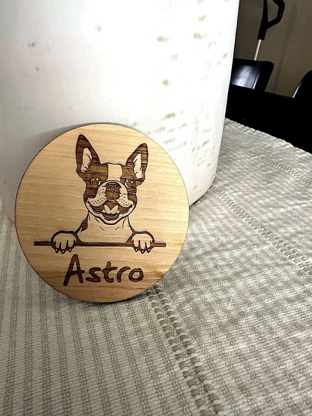 Round wooden ornament personalized with the pet Astro