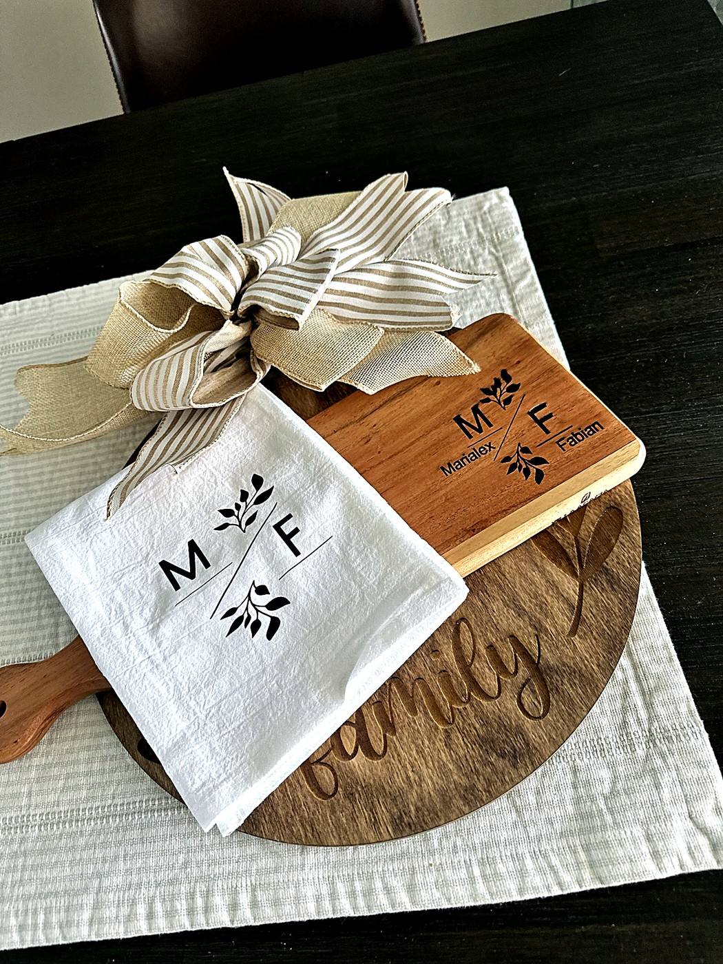 Wedding gift set for Marialex and Fabian with engraved board, towel, and family sign