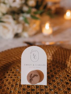 Emily and Carlos wedding place card with a personalized wooden ornament