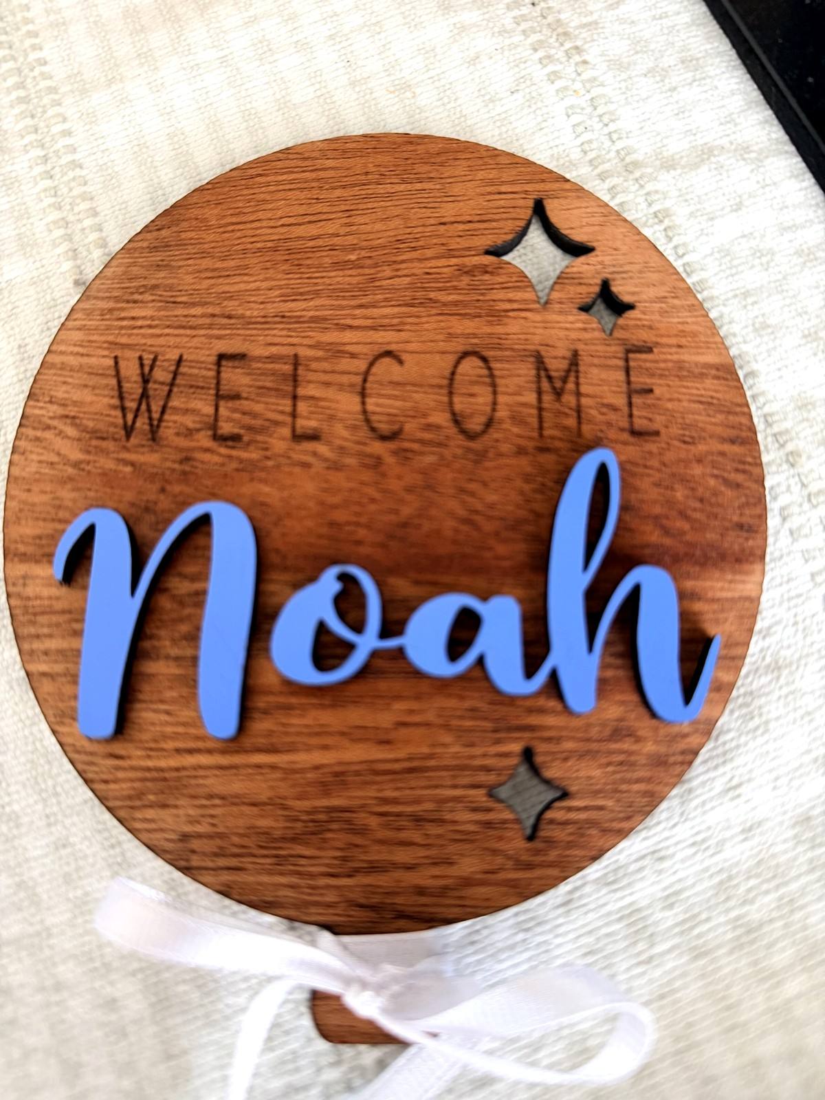 Round wooden Welcome Noah sign