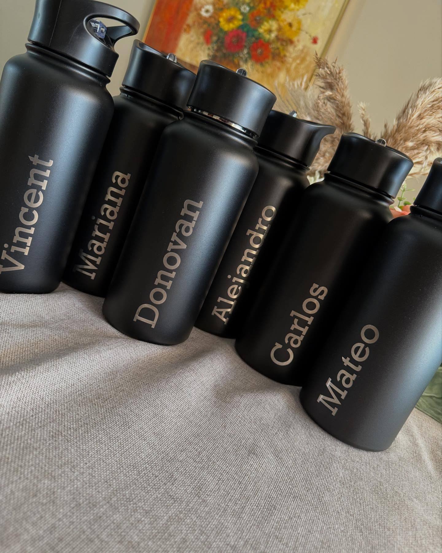Black bottles engraved with names